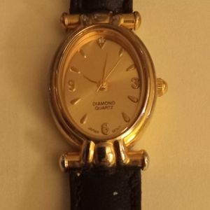 Diamond Quartz Gold face with black wristband Vintage watch